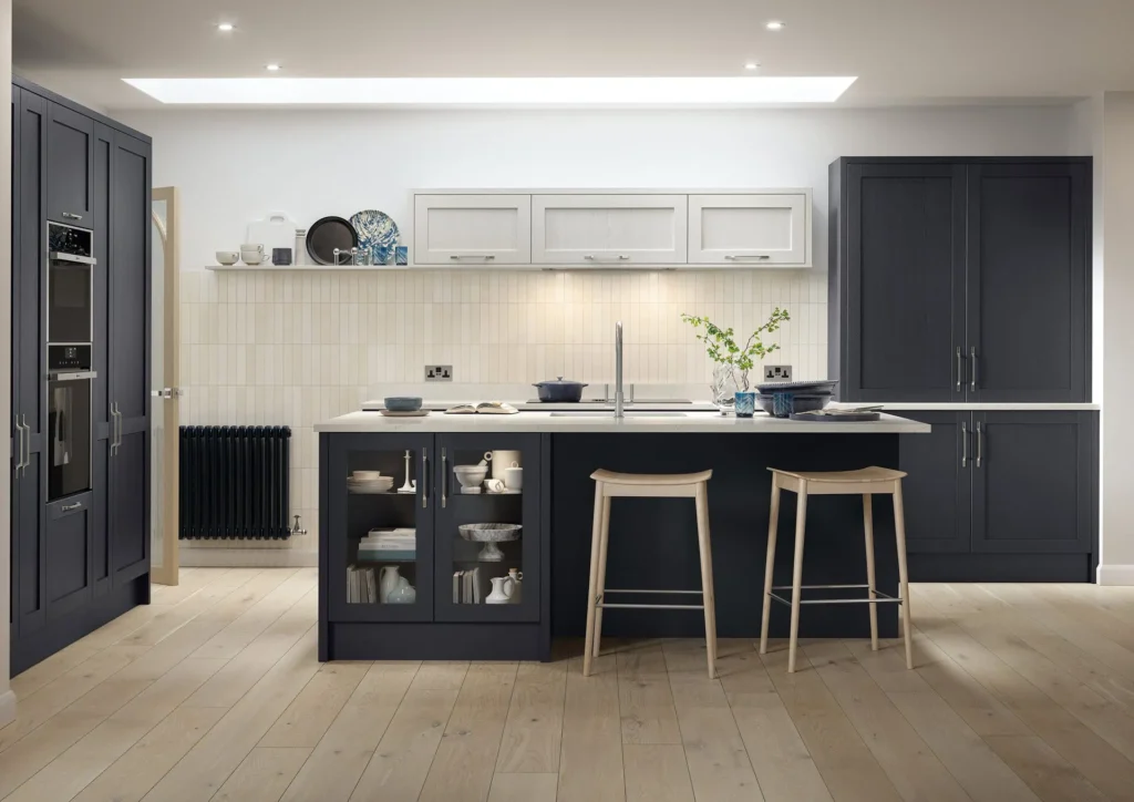Bespoke Kitchens by Georgie Hall indigo and light grey shaker kitchen with glazed island, cream tile splashback and roof lantern.